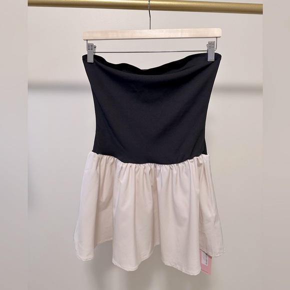 Mini tube dress with featuring a black top part and cream bottom from Micas. - Picture 2 of 5